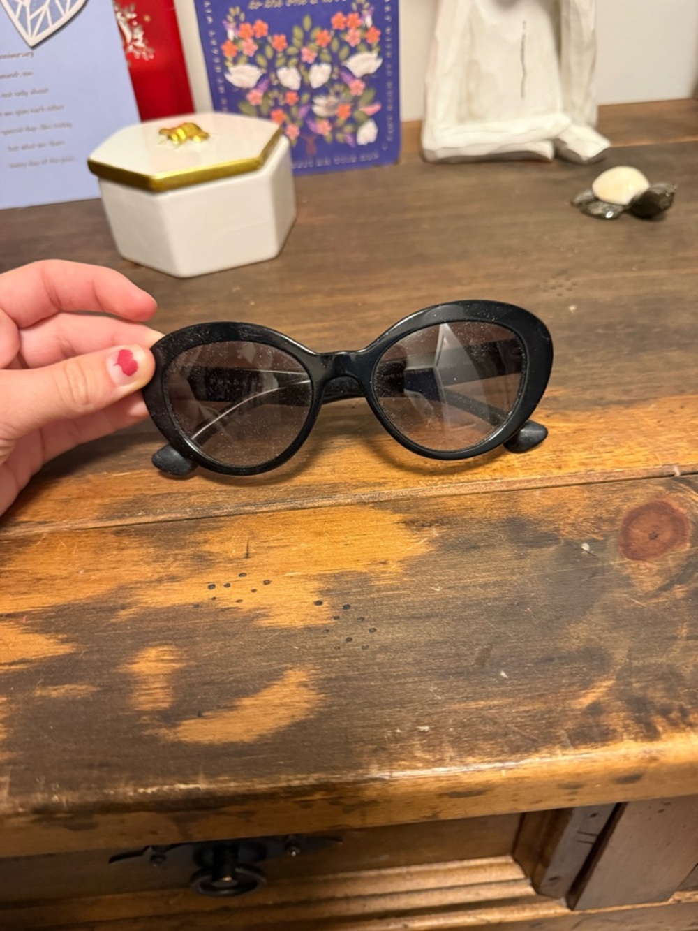 Prada Black Oval Sunglasses with Tinted Lenses